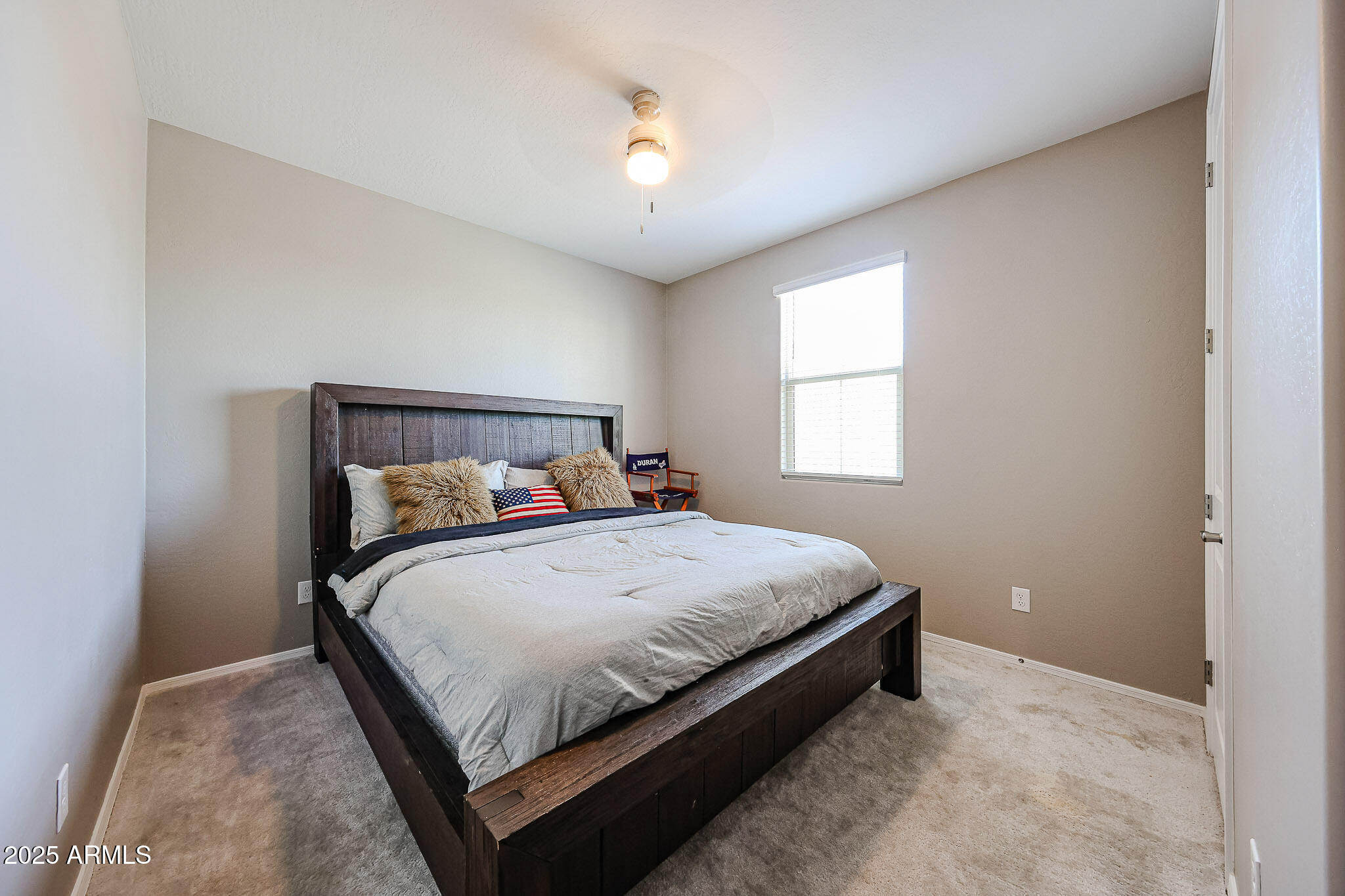 3907 South 75th Drive Phoenix, AZ 85043 - Photo 13 of 49 a bedroom with a bed and window