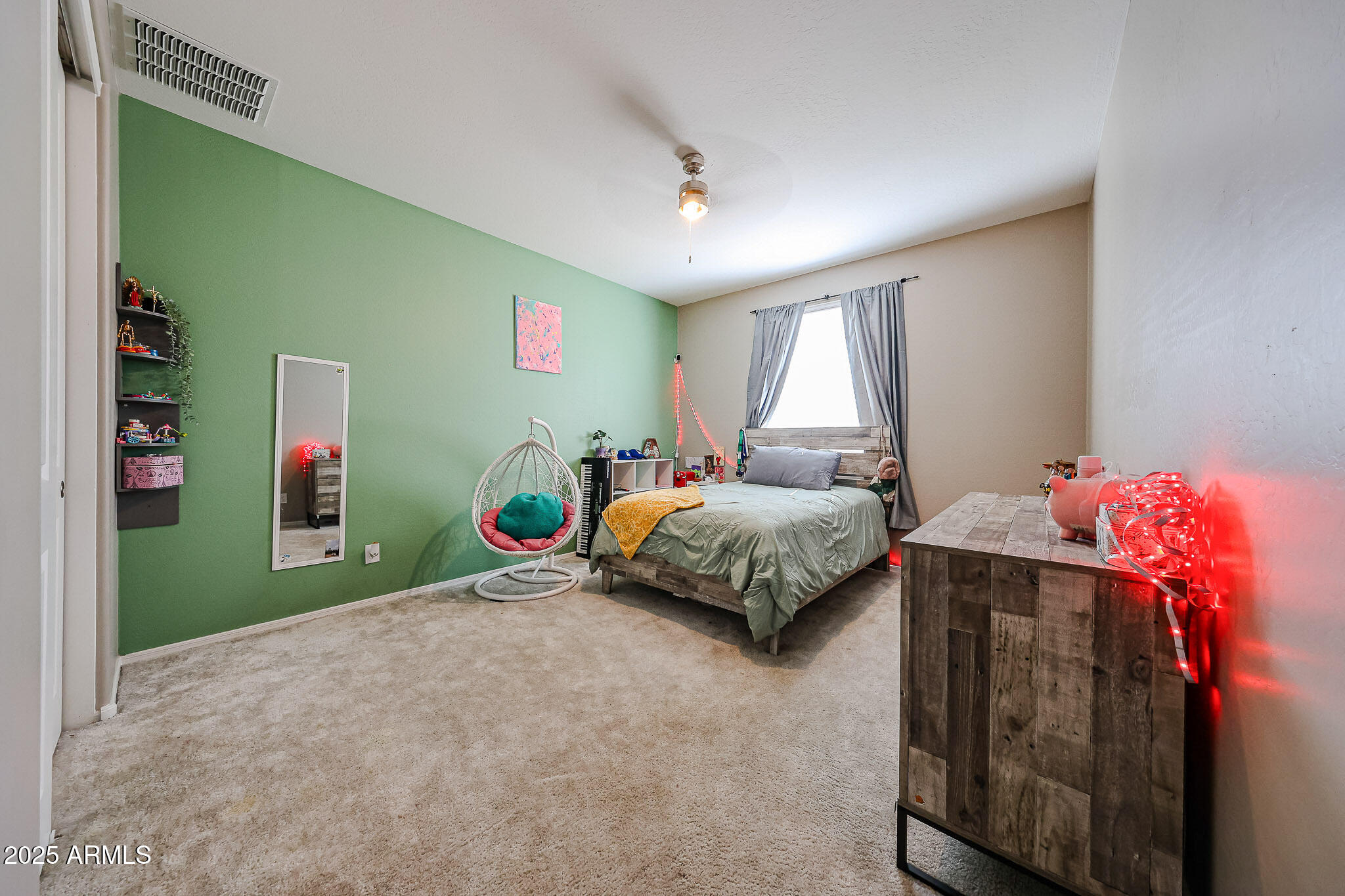 3907 South 75th Drive Phoenix, AZ 85043 - Photo 15 of 49 a bedroom with a bed and a window