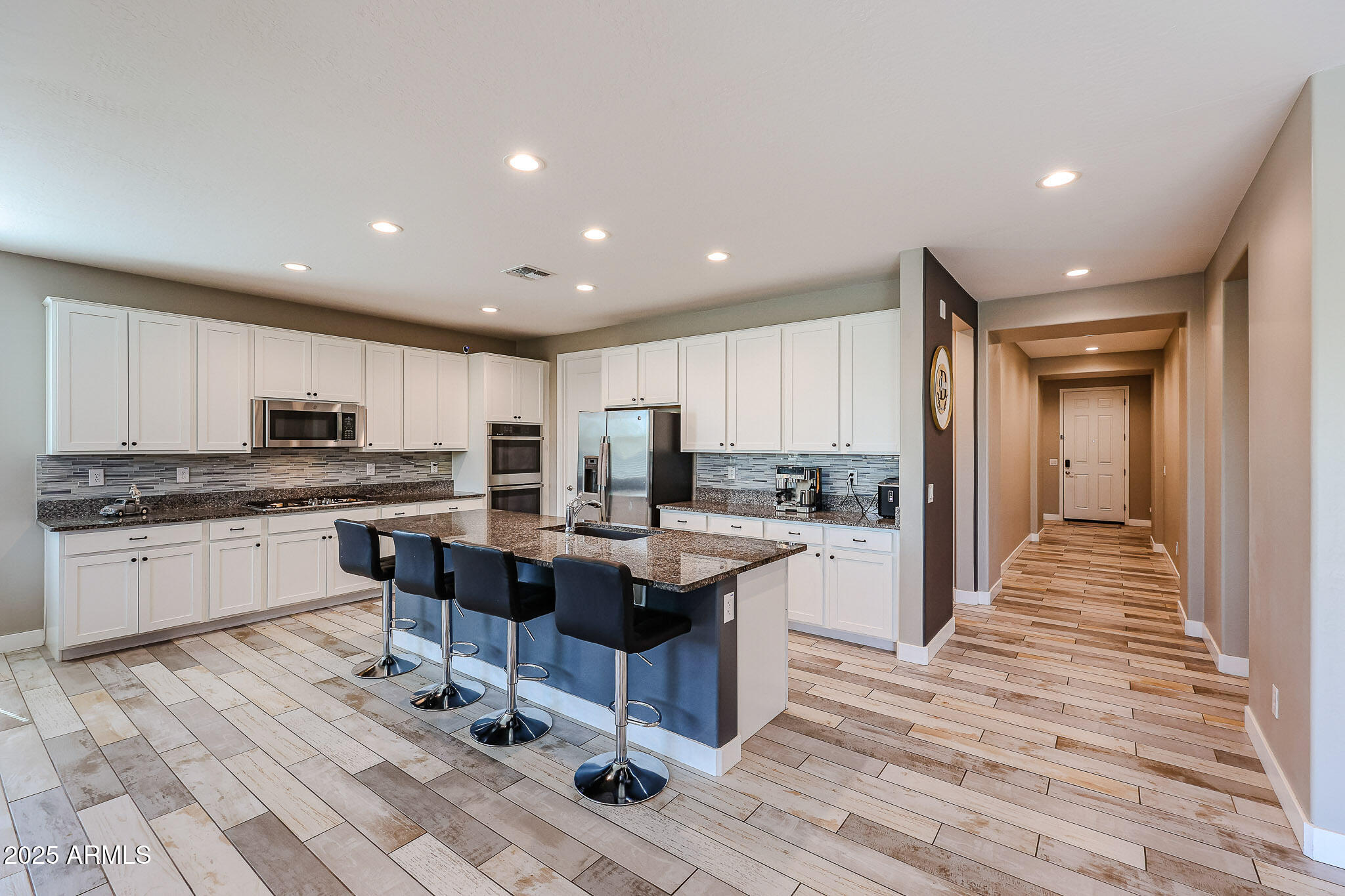 3907 South 75th Drive Phoenix, AZ 85043 - Photo 22 of 49 a kitchen with a sink and cabinets