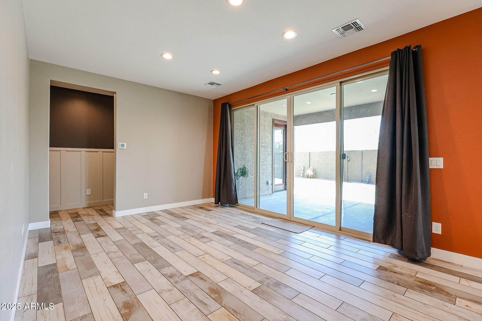 3907 South 75th Drive Phoenix, AZ 85043 - Photo 24 of 49 a view of an empty room and wooden floor