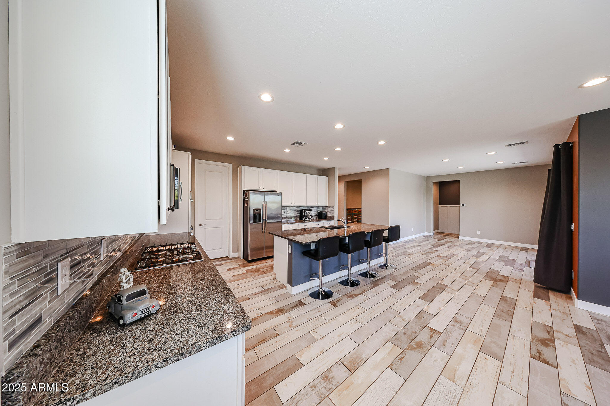 3907 South 75th Drive Phoenix, AZ 85043 - Photo 26 of 49 a living room with stainless steel appliances furniture and a rug