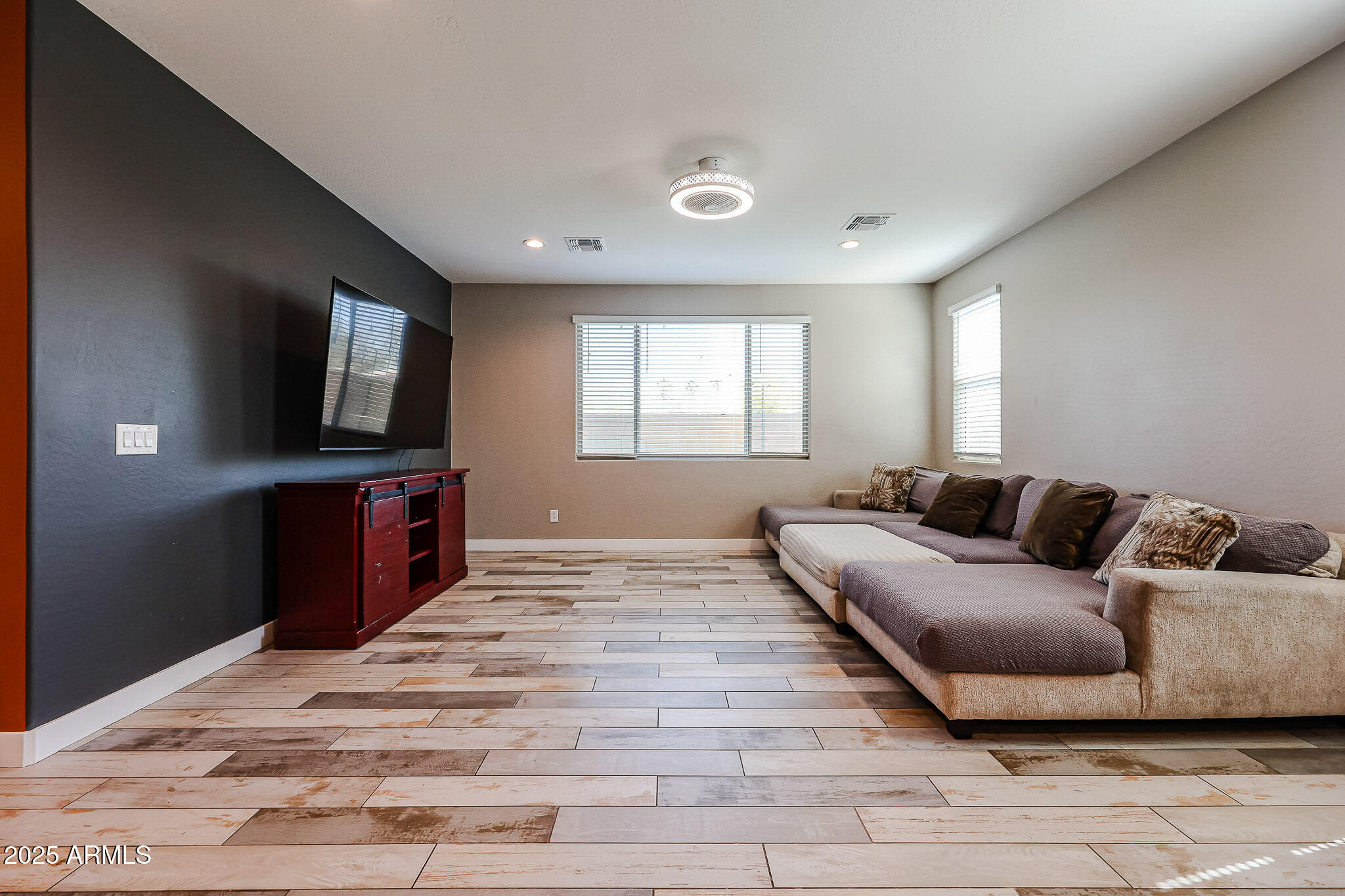 3907 South 75th Drive Phoenix, AZ 85043 - Photo 27 of 49 a living room with furniture and a flat screen tv