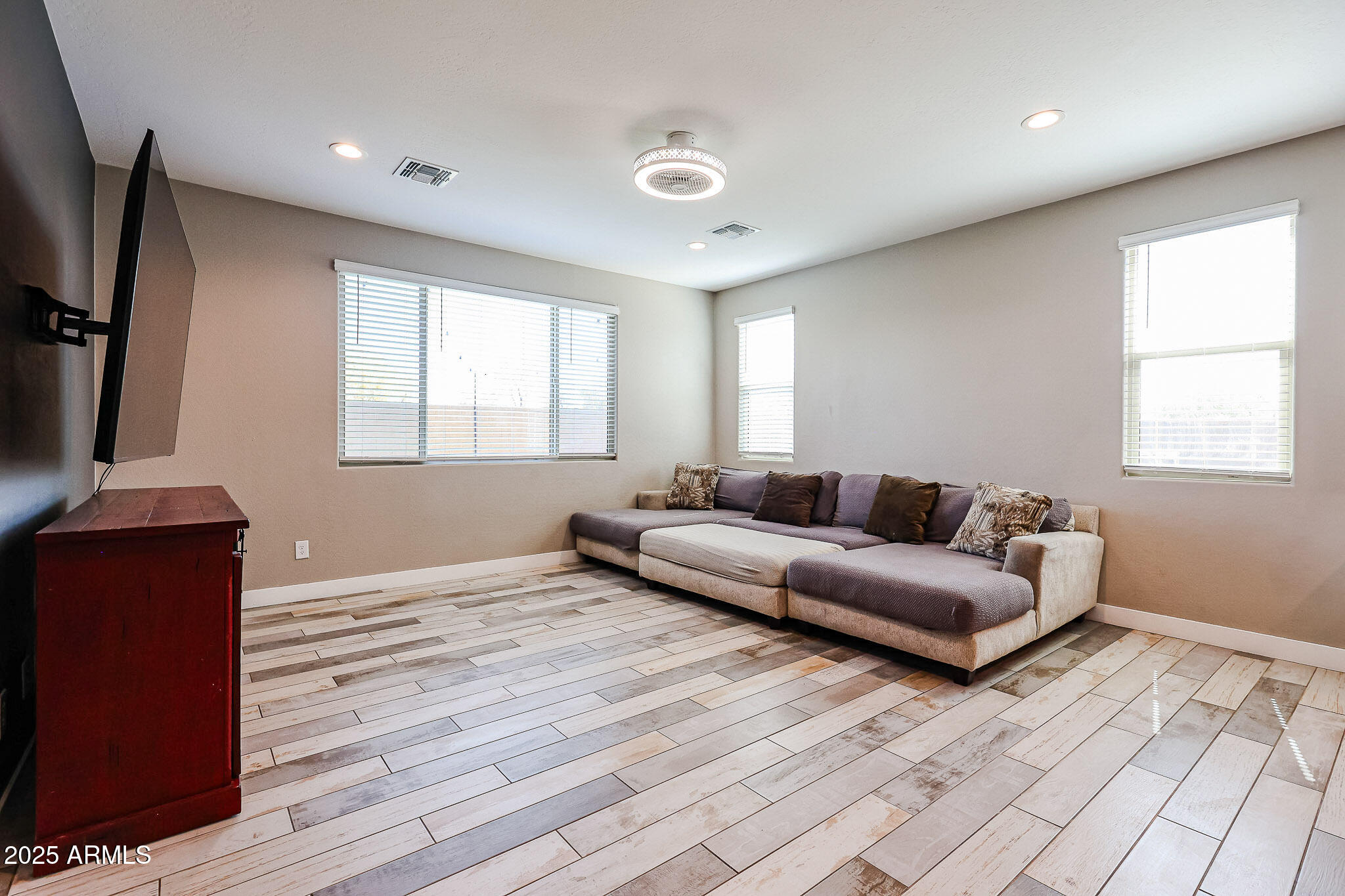 3907 South 75th Drive Phoenix, AZ 85043 - Photo 28 of 49 a living room with furniture and a flat screen tv