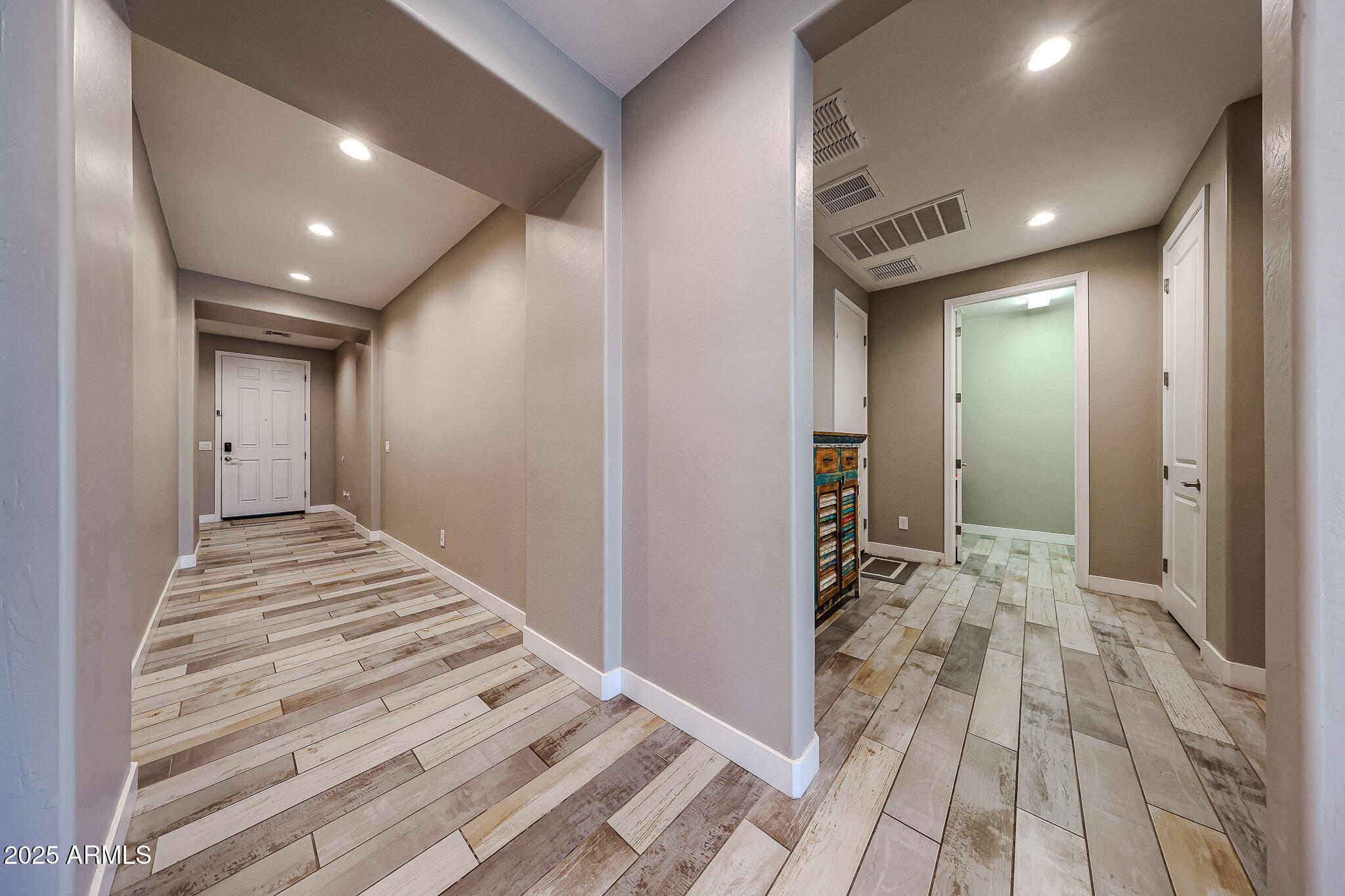 3907 South 75th Drive Phoenix, AZ 85043 - Photo 30 of 49 a view of a hallway with wooden floor and staircase