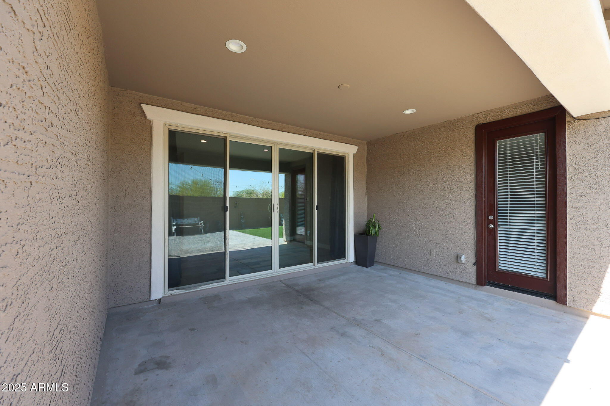 3907 South 75th Drive Phoenix, AZ 85043 - Photo 39 of 49 a view of an empty room with a sliding door
