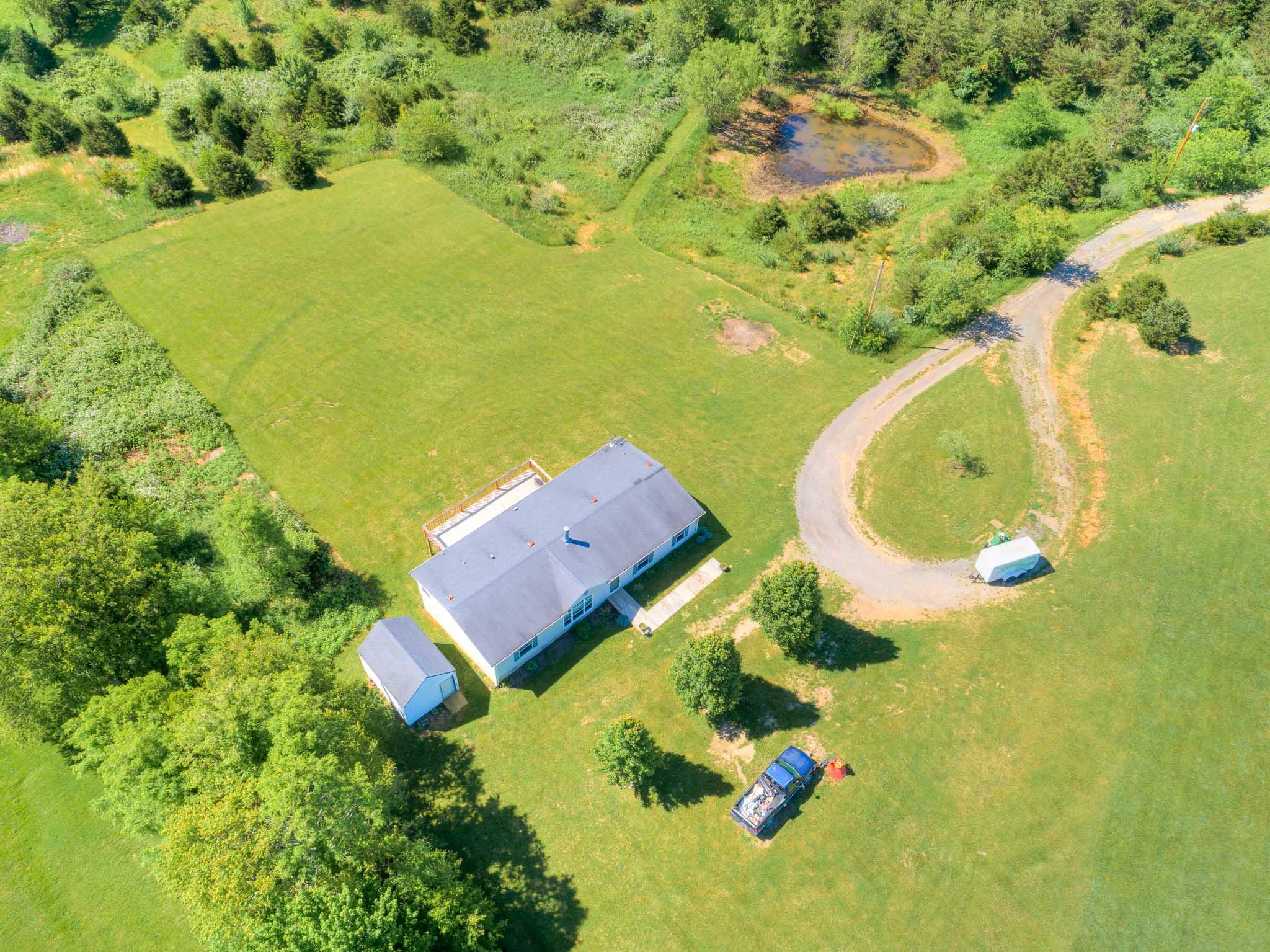 3240 Dallas Freeman Road Hiwassee, VA 24347 - Photo 2 of 42 an aerial view of residential houses with swimming pool and outdoor space