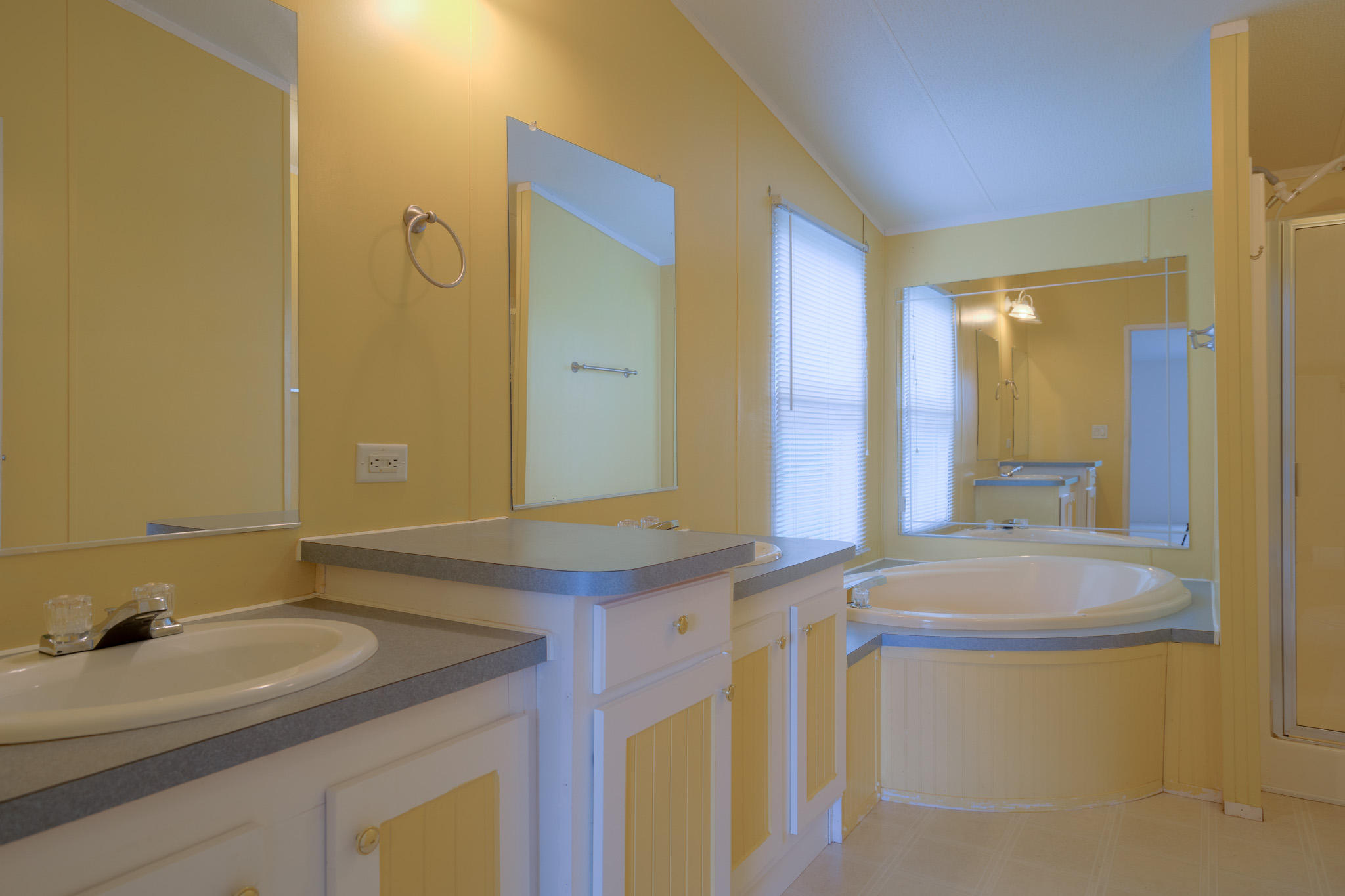 3240 Dallas Freeman Road Hiwassee, VA 24347 - Photo 13 of 42 a bathroom with a granite countertop sink and a mirror