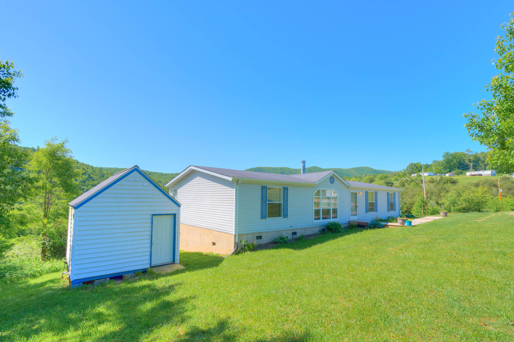 3240 Dallas Freeman Road Hiwassee, VA 24347 - Photo 25 of 42 a view of a house with a yard and sitting area