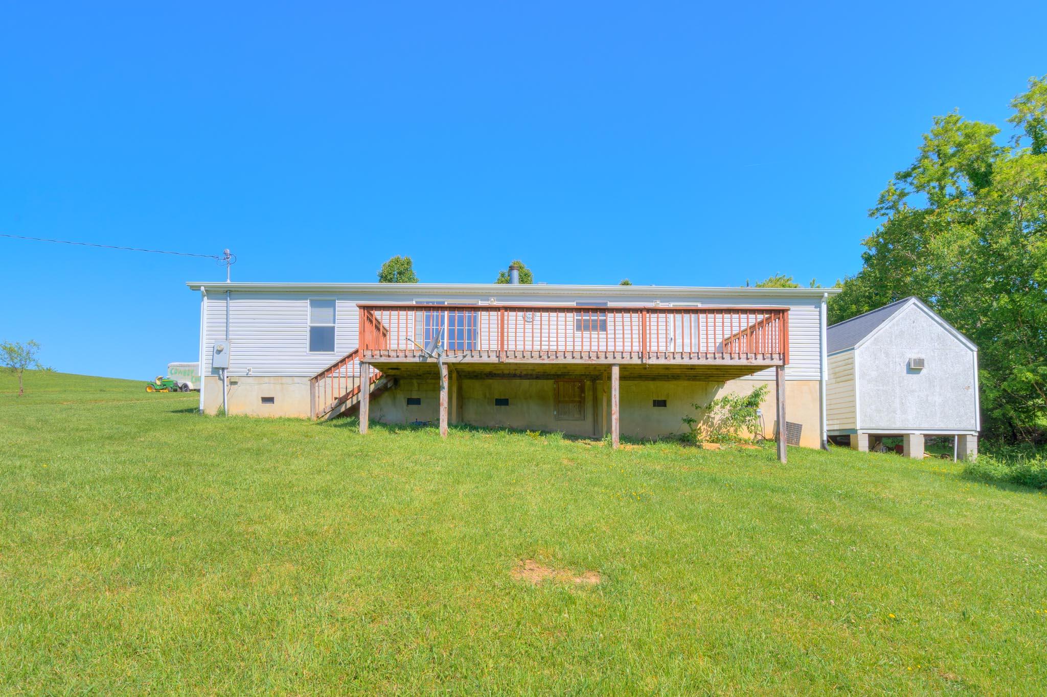 3240 Dallas Freeman Road Hiwassee, VA 24347 - Photo 27 of 42 a view of a house with a backyard and a patio