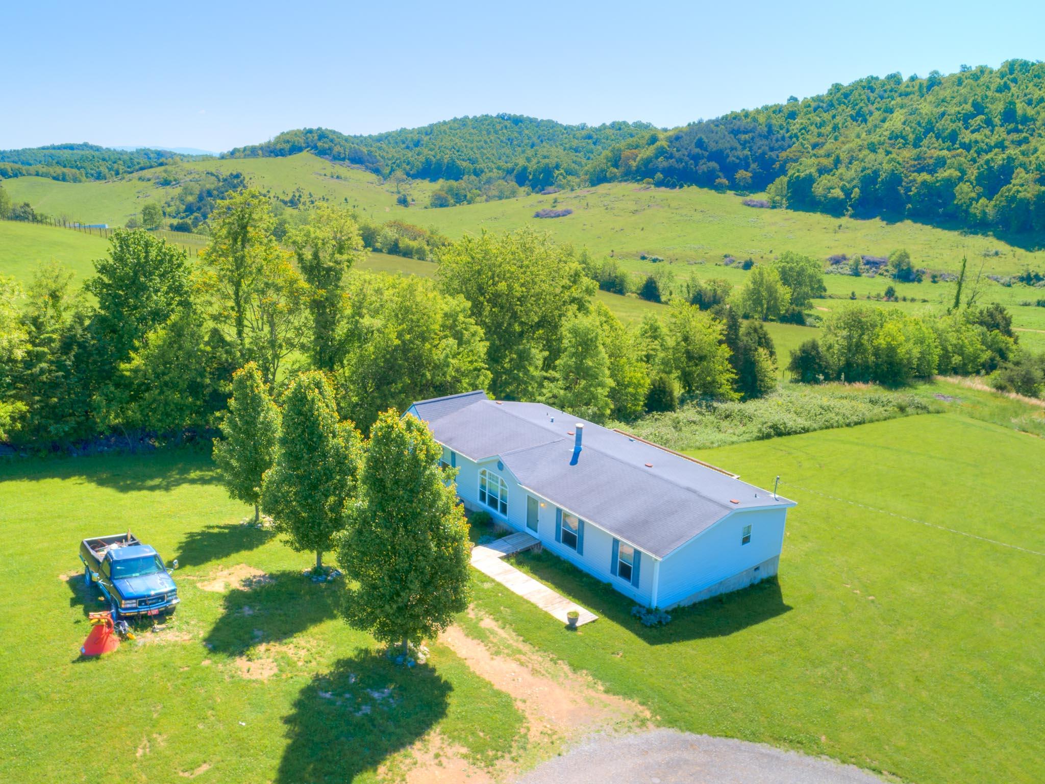3240 Dallas Freeman Road Hiwassee, VA 24347 - Photo 32 of 42 a view of a town with mountains in the background