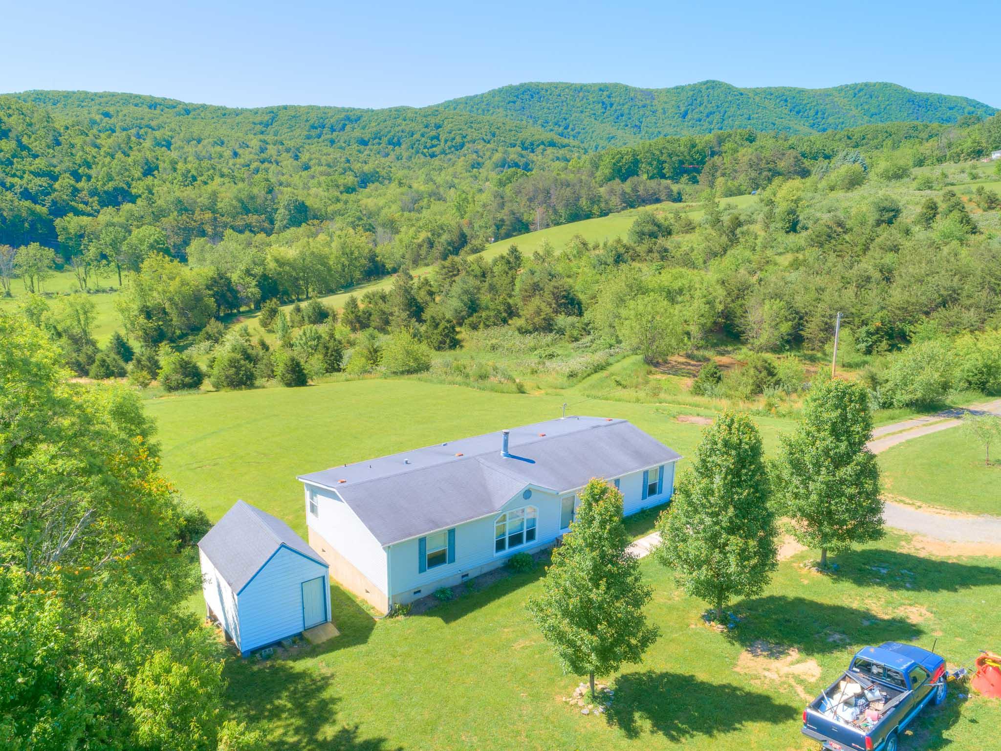 3240 Dallas Freeman Road Hiwassee, VA 24347 - Photo 34 of 42 an aerial view of a house with a garden
