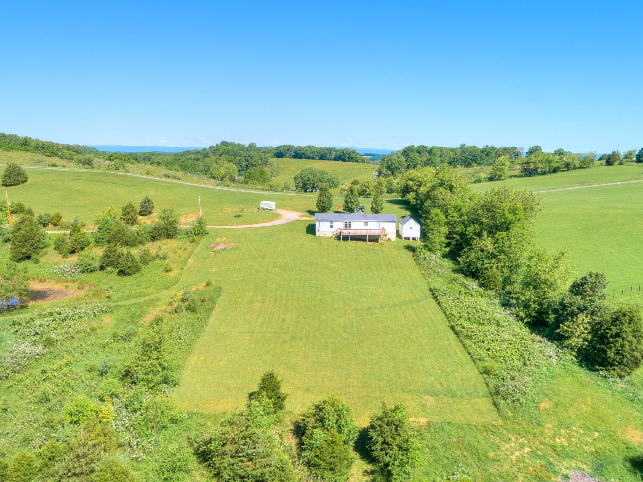3240 Dallas Freeman Road Hiwassee, VA 24347 - Photo 41 of 42 a view of a lake with a houses