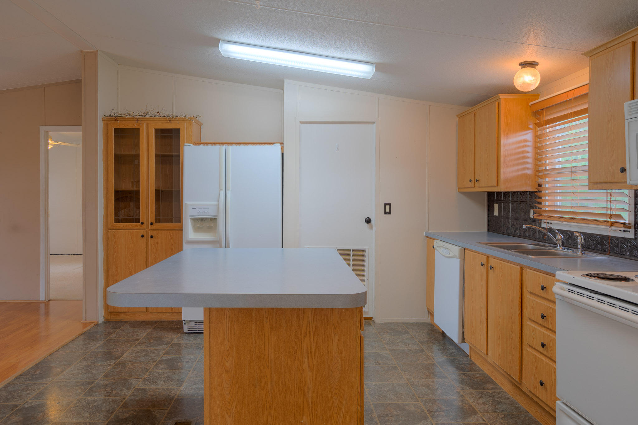 3240 Dallas Freeman Road Hiwassee, VA 24347 - Photo 8 of 42 a kitchen that has a sink and a stove in it