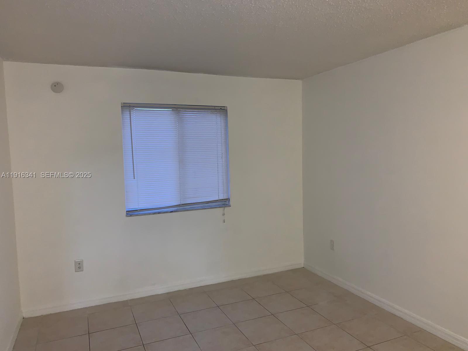 15221 Southwest 80th Street, Unit 404 Miami, FL 33193 - Photo 5 of 6 a view of an empty room