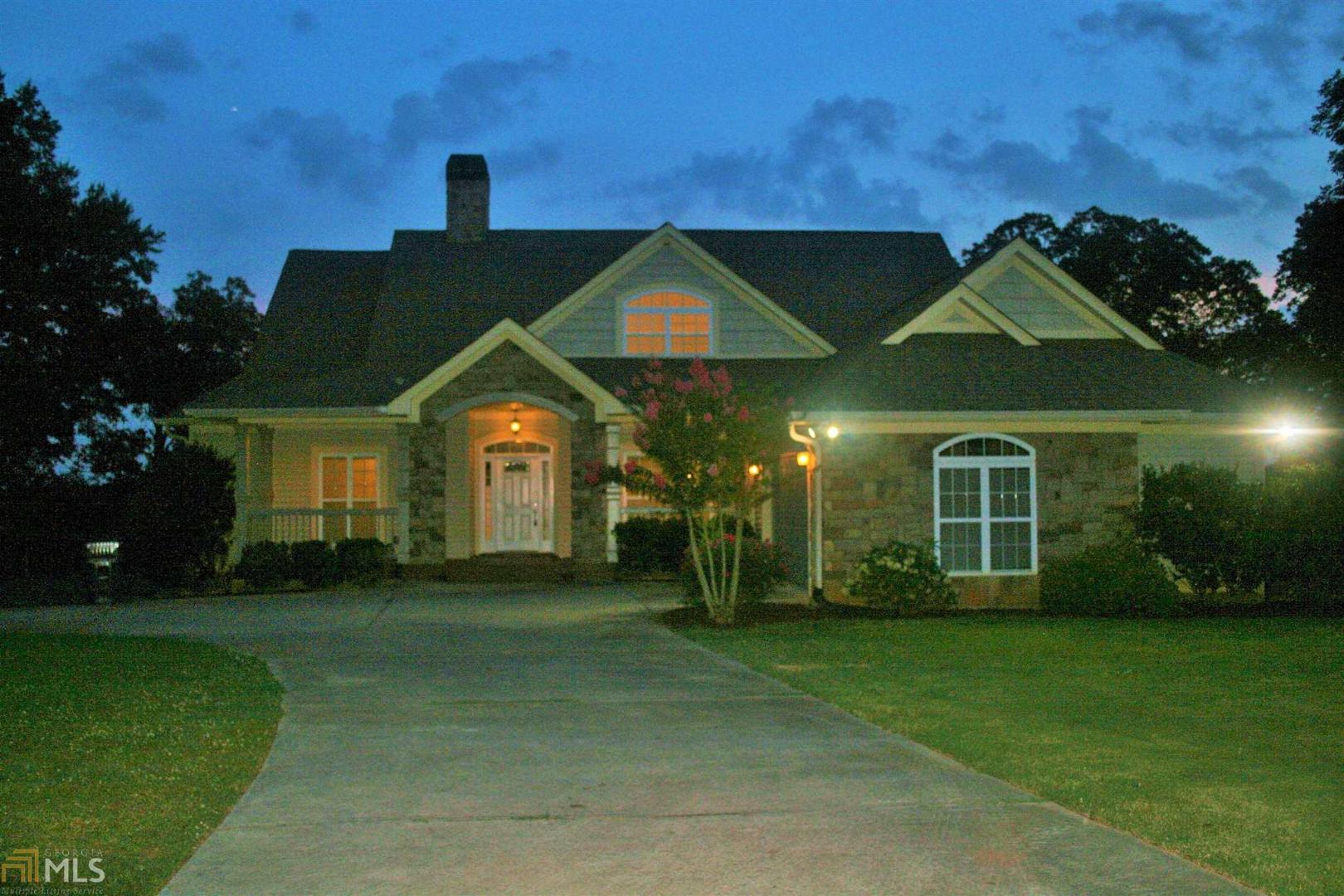 652 Hosannah Road Locust Grove, GA 30248 - Photo 1 of 1 a view of a big house with a big yard and large trees