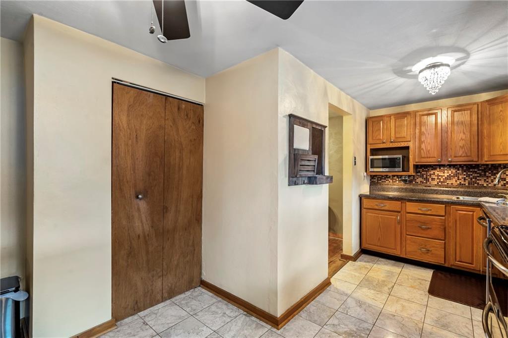 459 East Garden Road Pittsburgh, PA 15227 - Photo 11 of 35 a kitchen with stainless steel appliances granite countertop a refrigerator and a stove top oven