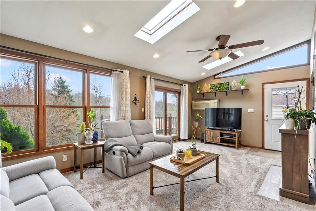 459 East Garden Road Pittsburgh, PA 15227 - Photo 13 of 35 a living room with furniture a flat screen tv and a large window