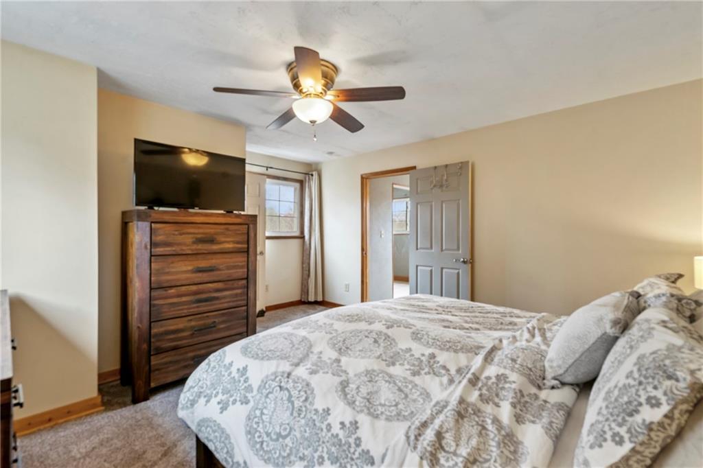 459 East Garden Road Pittsburgh, PA 15227 - Photo 19 of 35 a bedroom with a bed and a flat screen tv