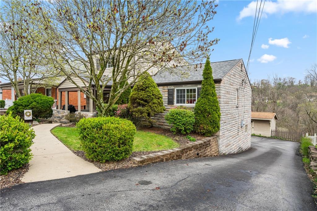 459 East Garden Road Pittsburgh, PA 15227 - Photo 2 of 35 a front view of a house with a yard and garage