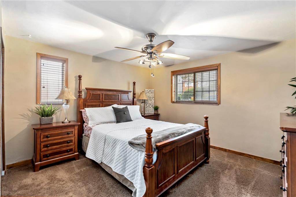 459 East Garden Road Pittsburgh, PA 15227 - Photo 21 of 35 a bedroom with a bed and a chandelier