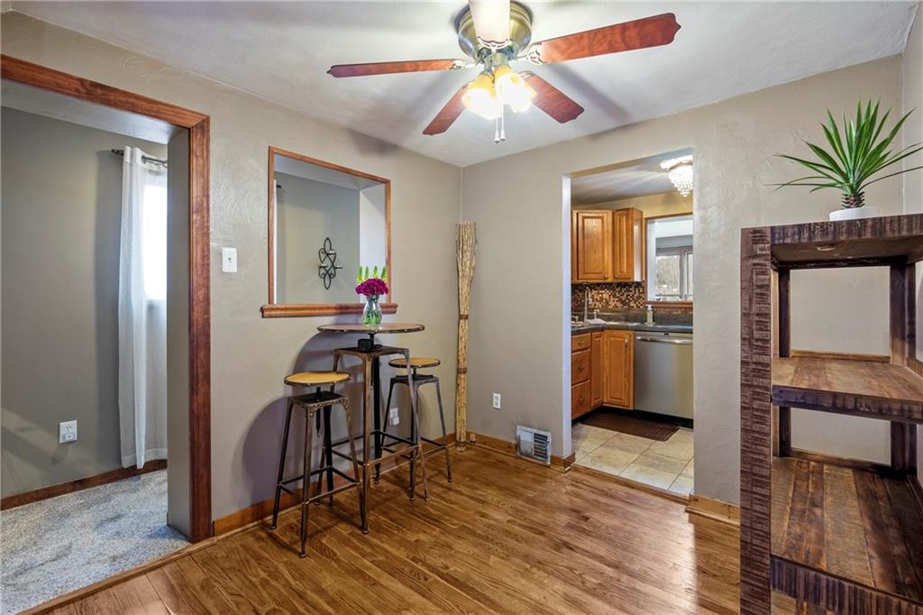 459 East Garden Road Pittsburgh, PA 15227 - Photo 7 of 35 a view of a livingroom with furniture a dinning room and wooden floor