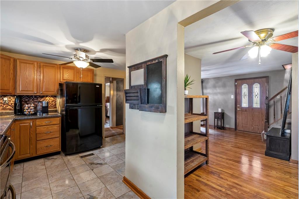459 East Garden Road Pittsburgh, PA 15227 - Photo 8 of 35 a kitchen with stainless steel appliances kitchen island granite countertop a refrigerator and a sink