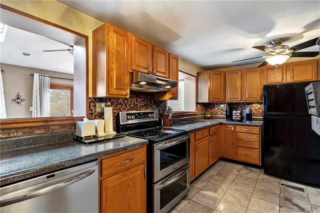 459 East Garden Road Pittsburgh, PA 15227 - Photo 9 of 35 a kitchen with stainless steel appliances granite countertop a stove a sink dishwasher and a refrigerator