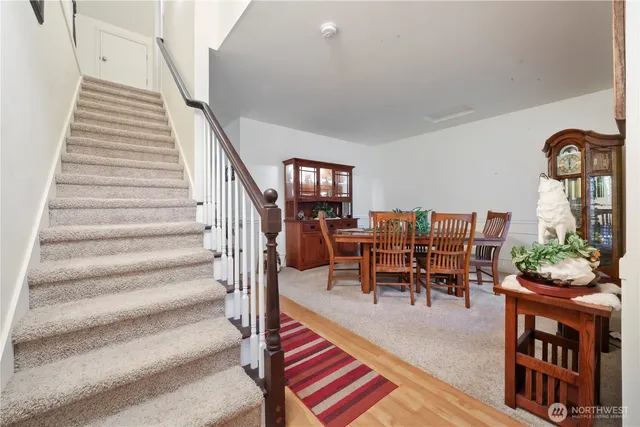 a view of a livingroom with furniture and lounge chair