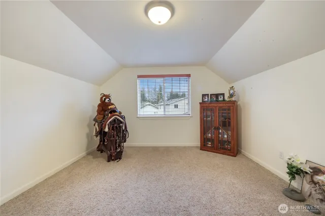 a view of a livingroom with furniture and a window