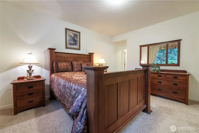 a bedroom with a bed and a dresser