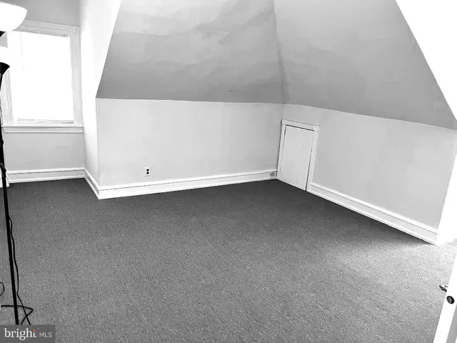 a view of a bedroom with gym equipment