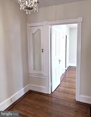 a view of entryway with wooden floor