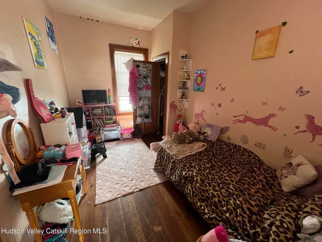 a room with furniture and wooden floor