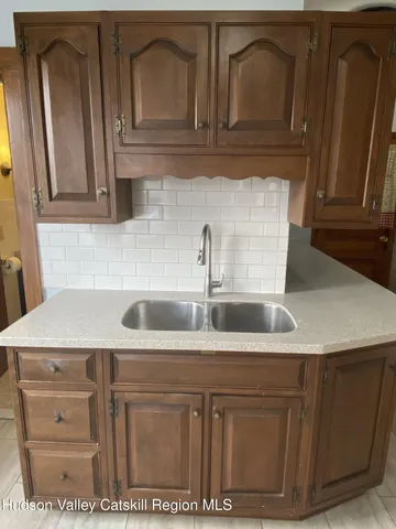a view of a livingroom with furniture and a flat screen tv