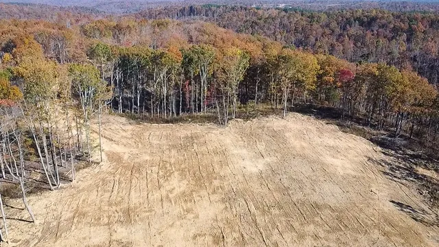 a view of a yard covered with snow in the background