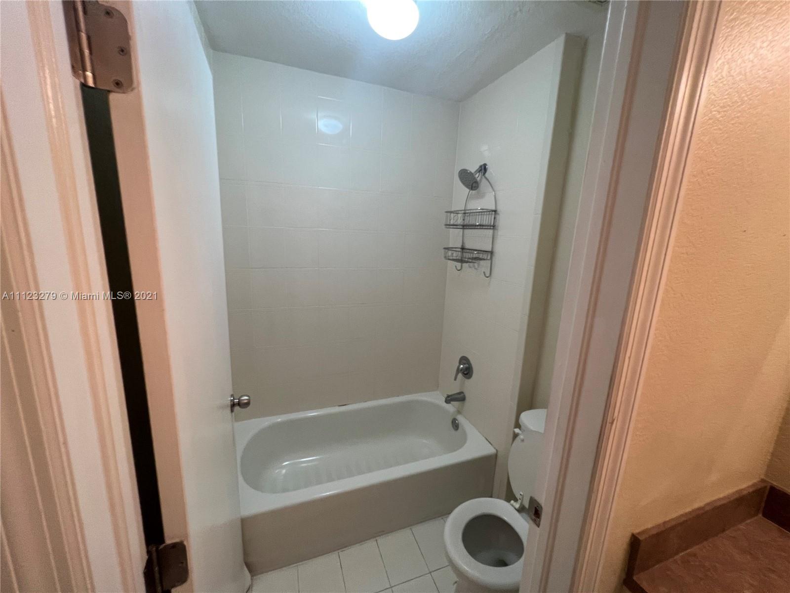 20441 Northwest 15th Avenue, Unit 8 Miami Gardens, FL 33169 - Photo 16 of 30 a bathroom with a tub and a sink