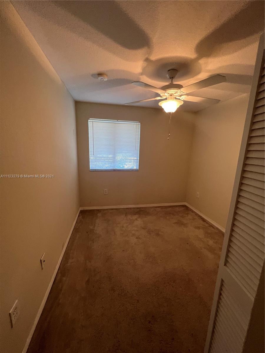 20441 Northwest 15th Avenue, Unit 8 Miami Gardens, FL 33169 - Photo 19 of 30 wooden floor in an empty room