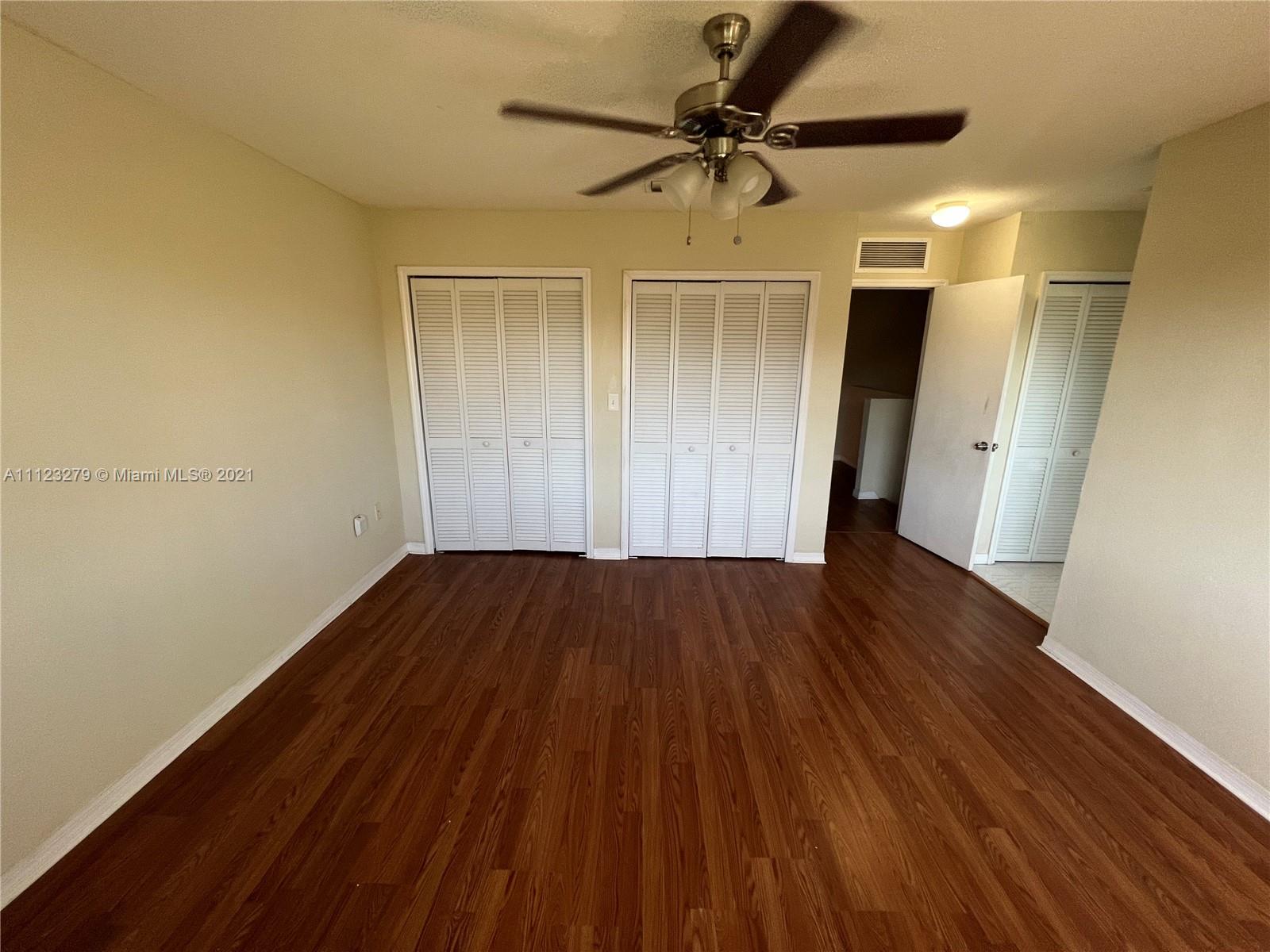 20441 Northwest 15th Avenue, Unit 8 Miami Gardens, FL 33169 - Photo 23 of 30 a view of empty room with wooden floor
