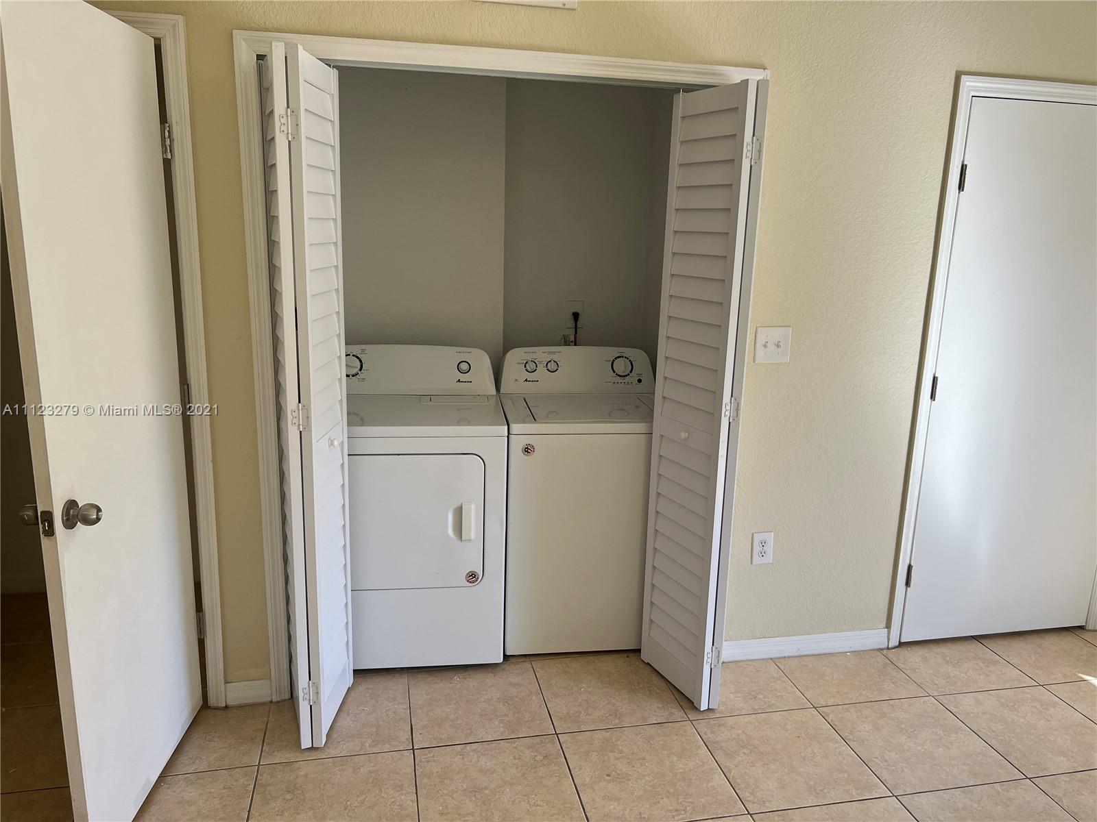 20441 Northwest 15th Avenue, Unit 8 Miami Gardens, FL 33169 - Photo 29 of 30 a view of a utility room with closet