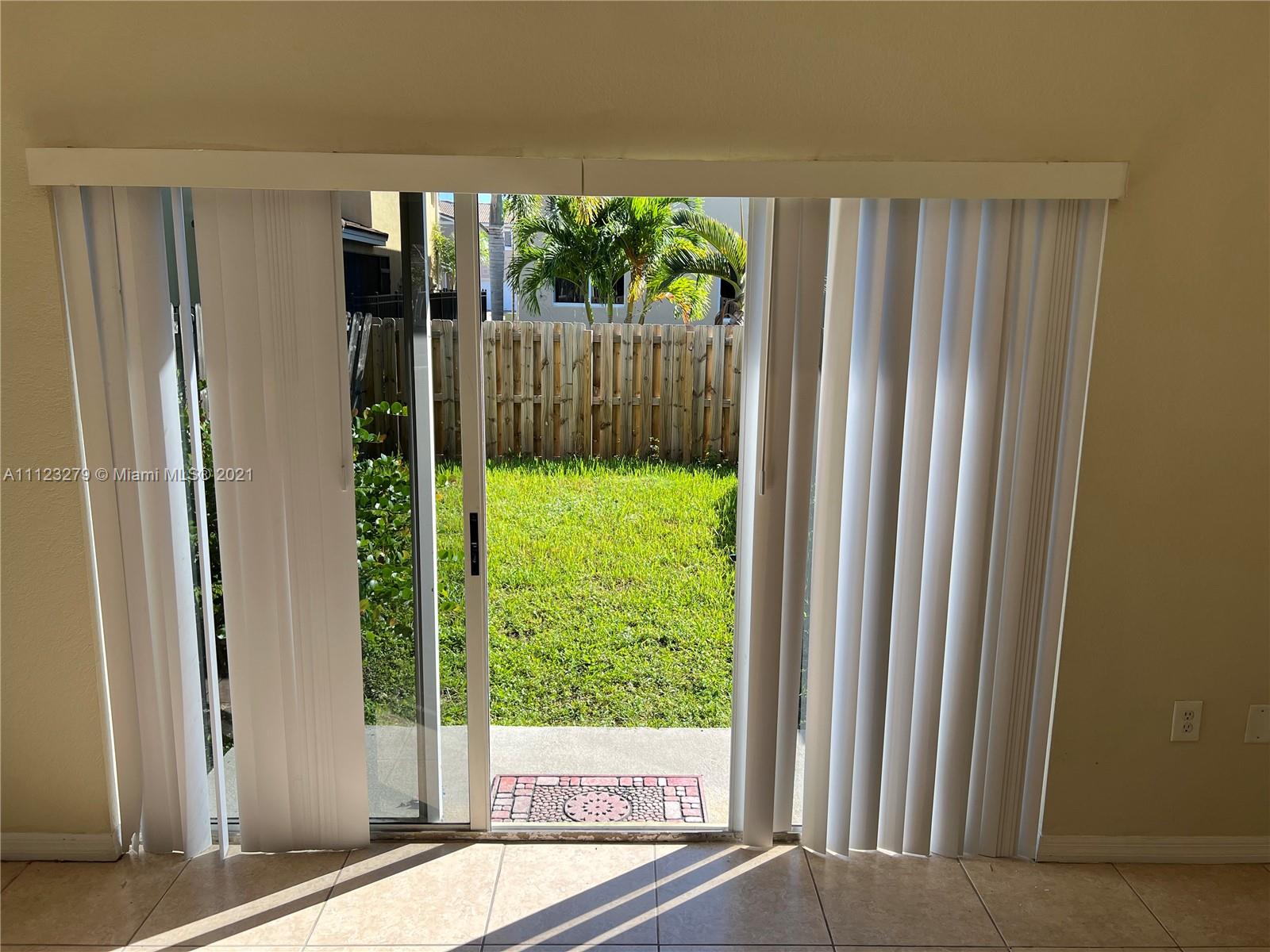 20441 Northwest 15th Avenue, Unit 8 Miami Gardens, FL 33169 - Photo 30 of 30 a view of a garden from a windows