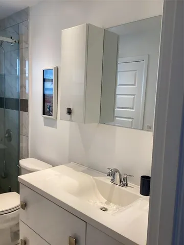 a bathroom with a sink and a toilet