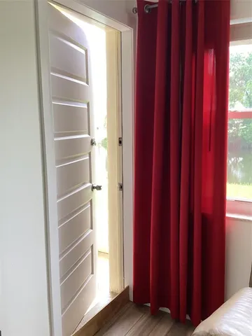 a view of walk in closet with empty walls