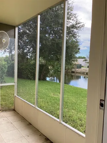 a view of a glass door and a yard