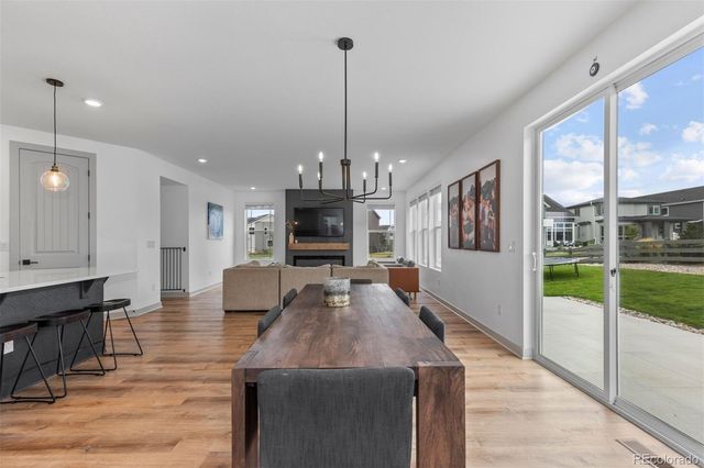 a view of a living room and kitchen floor to ceiling window