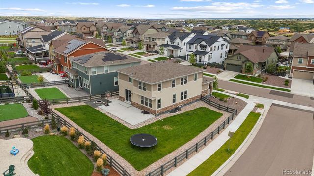 an aerial view of a house with a big yard