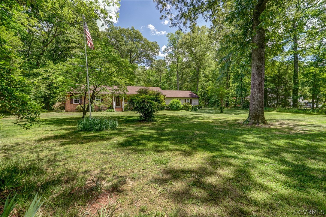 7651 Varann Road Henrico, VA 23231 - Photo 2 of 44 a view of a park with large trees