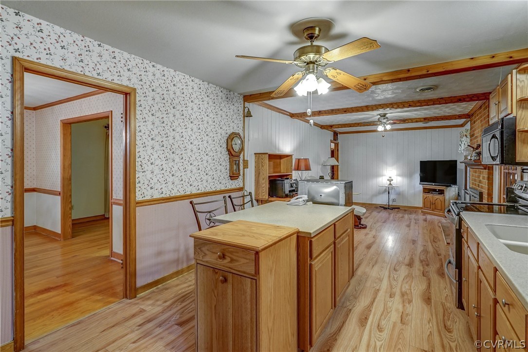 7651 Varann Road Henrico, VA 23231 - Photo 28 of 44 a view of a living room and kitchen with a flat screen tv