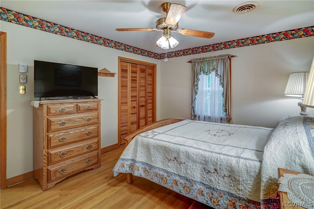 7651 Varann Road Henrico, VA 23231 - Photo 34 of 44 a bedroom with a bed and a flat screen tv
