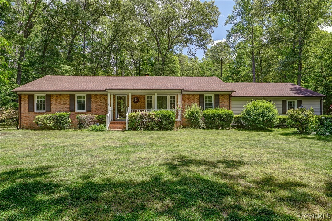 7651 Varann Road Henrico, VA 23231 - Photo 4 of 44 a front view of a house with a yard