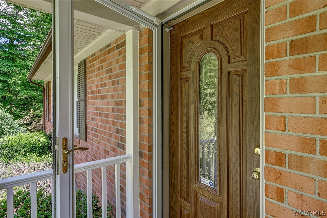 7651 Varann Road Henrico, VA 23231 - Photo 8 of 44 a view of a wooden door with a glass door